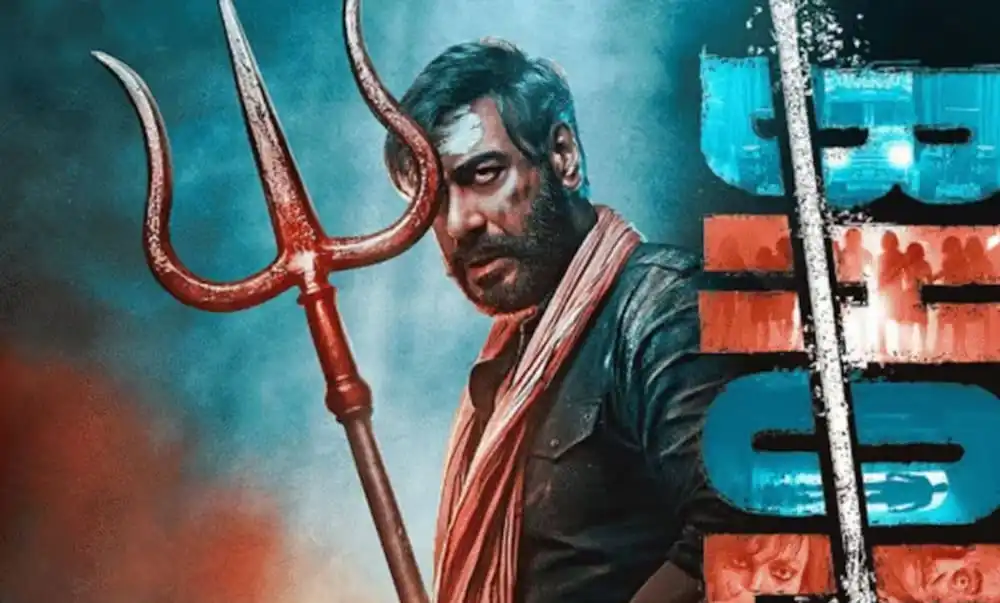 অজয়ের ‘ভোলা’ সিনেমার পোস্টার যেখানে তিনি ট্রেডিশনাল পোশাকে দাঁড়িয়ে আছেন. Channel i News - চ্যানেল আই নিউজ