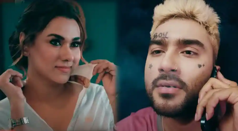 একজন নারী ও একজন পুরুষ মোবাইল ফোনে কথা বলছেন, যুবকদের জীবনধারা ফুটে উঠেছে. Channel i News - চ্যানেল আই নিউজ