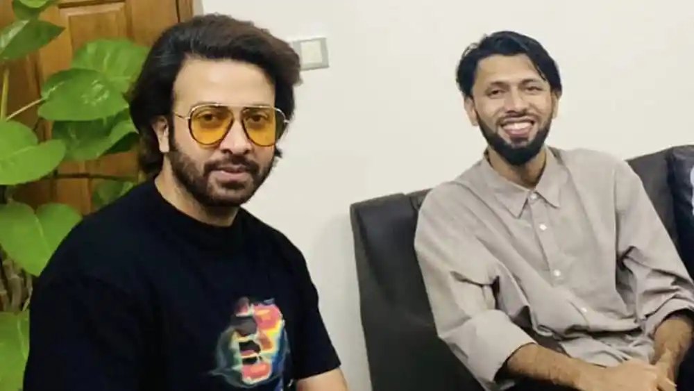 দুই ব্যক্তি হাসিমুখে বসে সাক্ষাৎকারের জন্য প্রস্তুত. Channel i News - চ্যানেল আই নিউজ