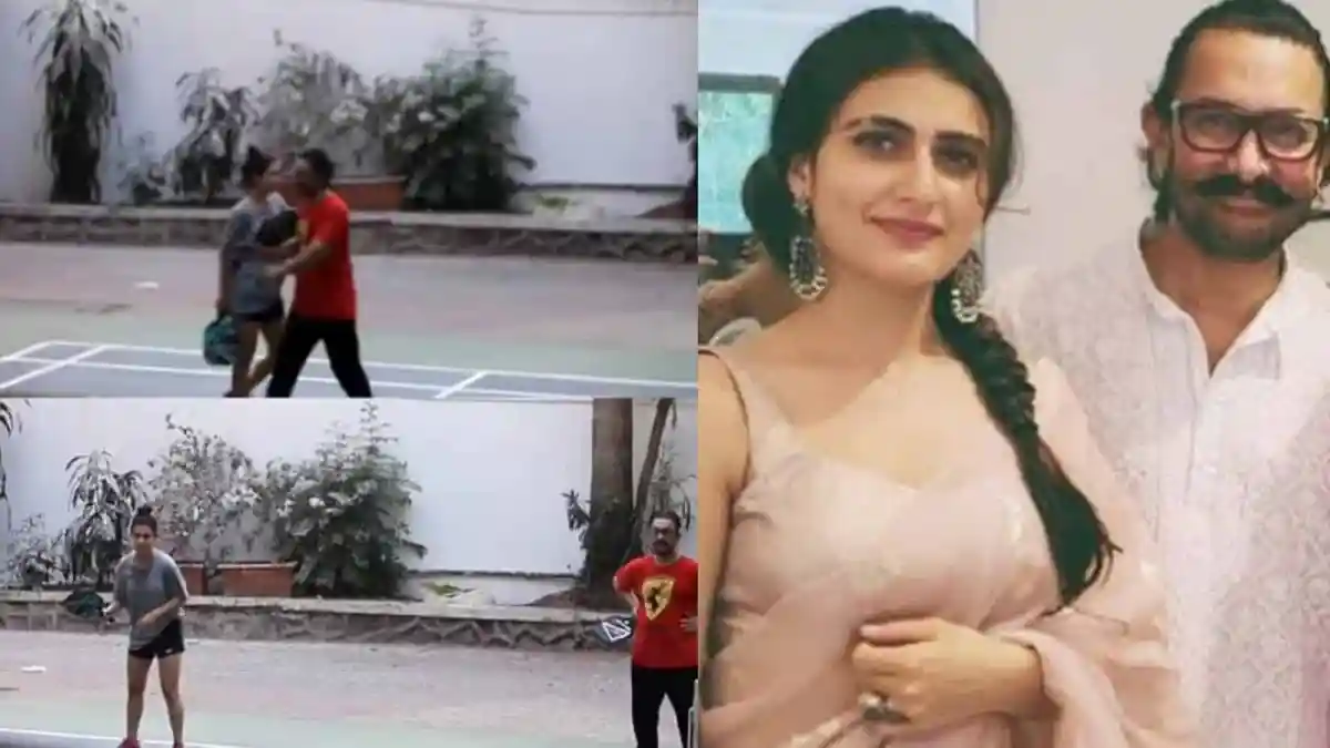 অপরিচিত দুই ব্যক্তি ফুটবল মাঠে কথা বলছেন, পেছনে গাছপালা. Channel i News - চ্যানেল আই নিউজ