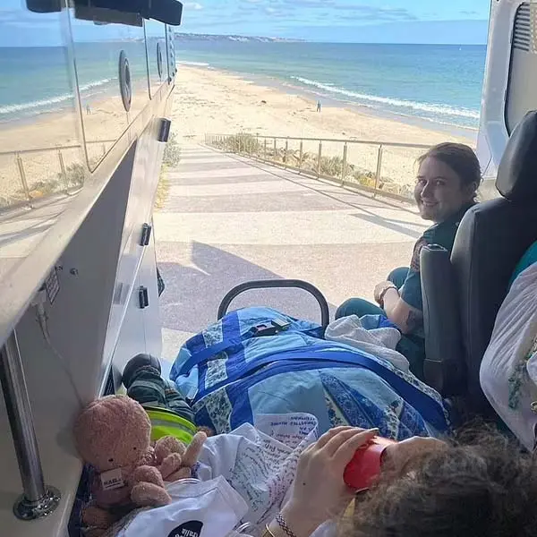 View of a sandy beach and ocean from inside an ambulance. Channel i News - চ্যানেল আই নিউজ