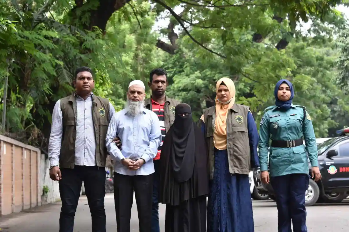 Group of six people standing outdoors in a green park setting. Channel i News - চ্যানেল আই নিউজ