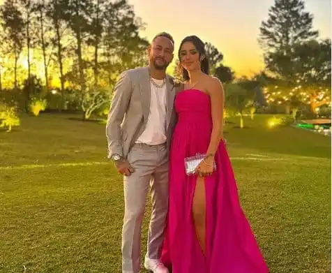 Stylish couple in formal attire at outdoor event during sunset. Channel i News - চ্যানেল আই নিউজ