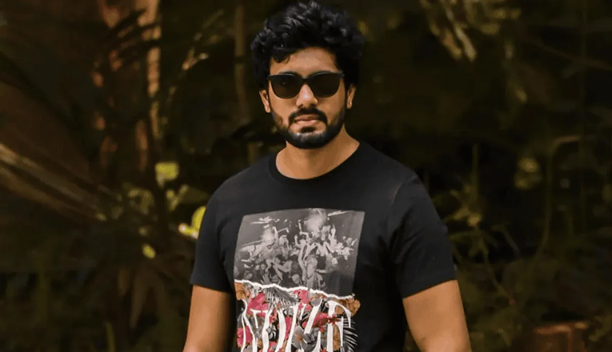 Stylish man with sunglasses and beard in casual black T-shirt outdoors. Channel i News - চ্যানেল আই নিউজ