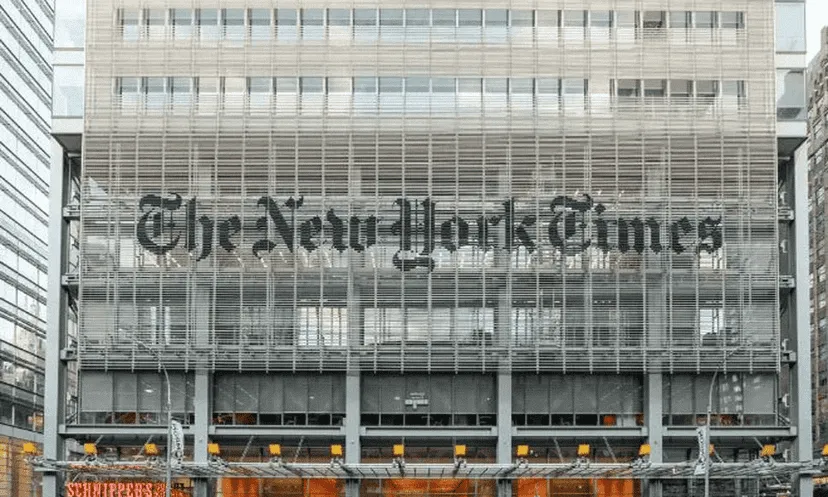The New York Times logo on the building facade in New York City. Channel i News - চ্যানেল আই নিউজ
