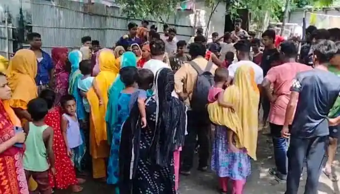 People gather at a riverbank during a tragic incident in Bangladesh. Channel i News - চ্যানেল আই নিউজ