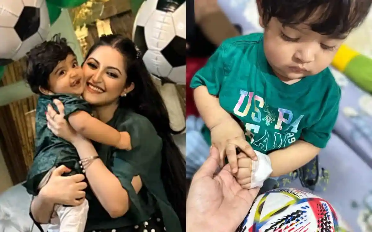 মা ও শিশু একসাথে হাসছে, শিশুটি মা এর গালে চুমু দিচ্ছে. Channel i News - চ্যানেল আই নিউজ