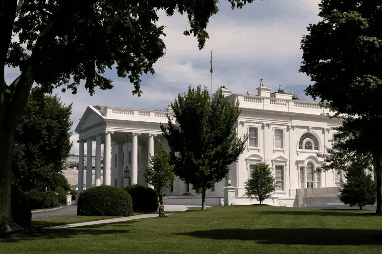 The White House in Washington D.C. surrounded by trees and greenery. Channel i News - চ্যানেল আই নিউজ