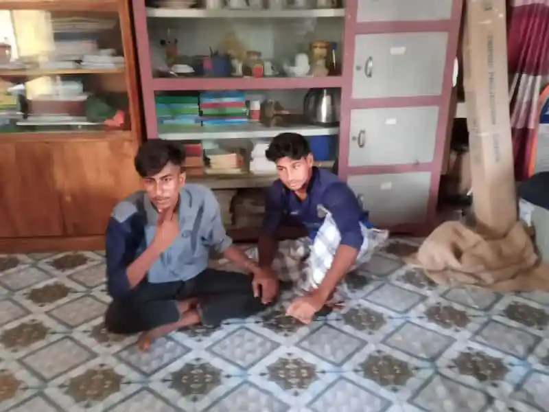 দুটি ছাত্র বসে পড়াশোনা করছে, ঘরের ভিতরে বই ও আলমারি দেখা যাচ্ছে. Channel i News - চ্যানেল আই নিউজ