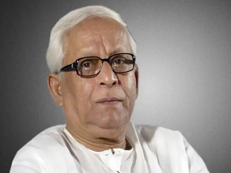 বুদ্ধদেব ভট্টাচার্য, বয়স্ক, সাদা চুল, চশমা পরা, পটভূমি ধূসর. Channel i News - চ্যানেল আই নিউজ