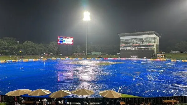 খেলাধুলার মাঠে টর্চলাইটের আলোতে জলাবদ্ধতা দেখা যাচ্ছে।. Channel i News - চ্যানেল আই নিউজ