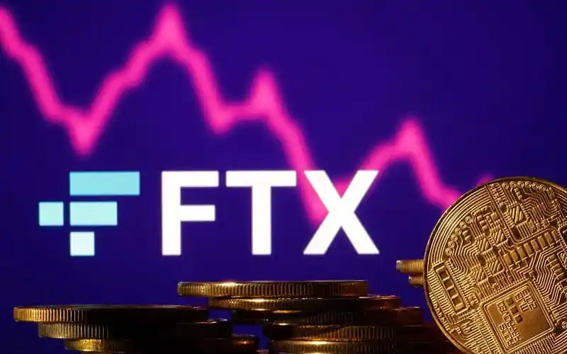 FTX cryptocurrency logo with falling graph in background. Channel i News - চ্যানেল আই নিউজ