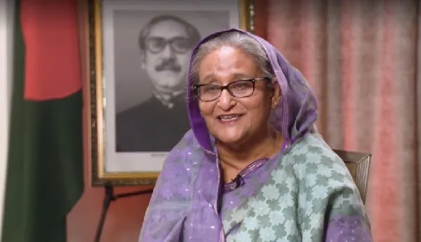 প্রধানমন্ত্রী শেখ হাসিনা হাস্যোজ্জ্বল মুখে সাক্ষাৎকার দিচ্ছেন. Channel i News - চ্যানেল আই নিউজ