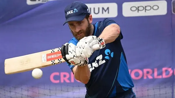 Williamson batting in a cricket match, wearing blue jersey and cap. Channel i News - চ্যানেল আই নিউজ