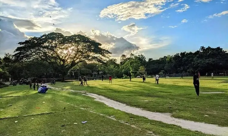 খেলার মাঠে শিশু ও যুবকরা খেলাধুলা করছে, সুন্দর প্রাকৃতিক পরিবেশে. Channel i News - চ্যানেল আই নিউজ