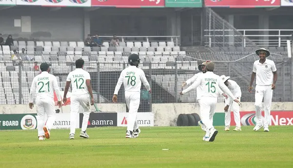Bangladeshi cricketers celebrating on the field during a match. Channel i News - চ্যানেল আই নিউজ