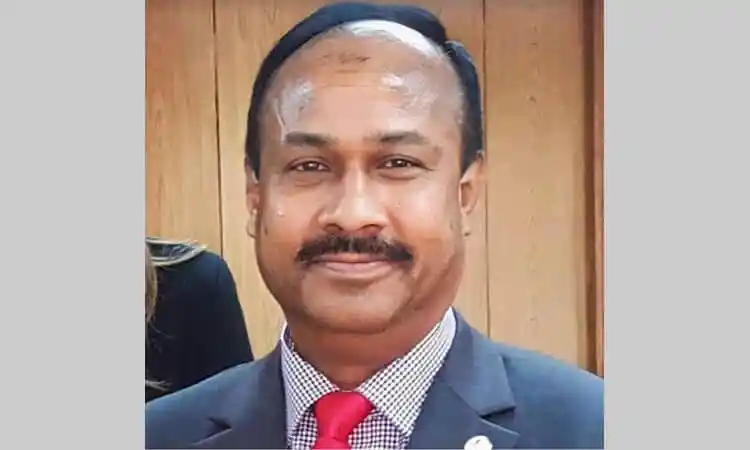 বাংলাদেশের একজন রাজনীতিবিদ, পেশাদার পোশাক পরিহিত, হাসিমুখে ছবি. Channel i News - চ্যানেল আই নিউজ