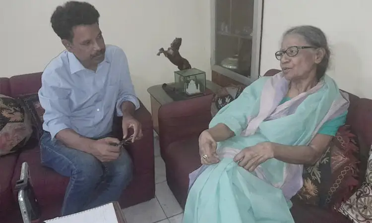 ব্রাজিলের কোচের ছবি, তিনি ভাষণ দিচ্ছেন, পেছনে ব্রাজিলের লেখা. Channel i News - চ্যানেল আই নিউজ