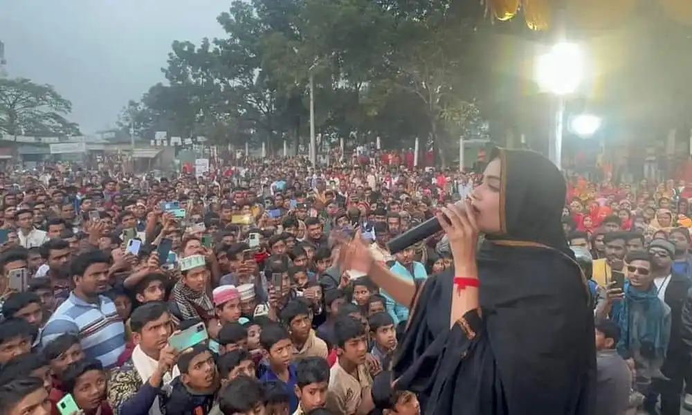 জনসমাগমের মাঝে বক্তা ভাষণ দিচ্ছেন, উৎসবমুখর পরিবেশ. Channel i News - চ্যানেল আই নিউজ