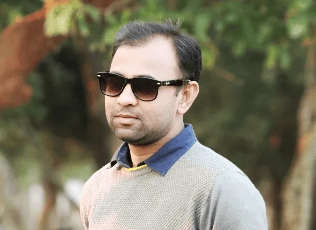 নেতার মুখাবয়ব, sunglasses পরা, শান্ত ও আত্মবিশ্বাসী. Channel i News - চ্যানেল আই নিউজ