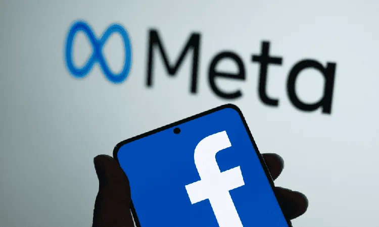 Meta Facebook logo displayed on smartphone screen in front of Meta logo. Channel i News - চ্যানেল আই নিউজ
