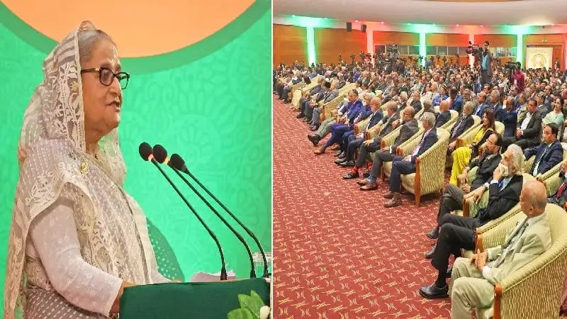 প্রধানমন্ত্রী জনসম্মেলনে ভাষণ দিচ্ছেন, দর্শক শ্রোতা উপস্থিত. Channel i News - চ্যানেল আই নিউজ