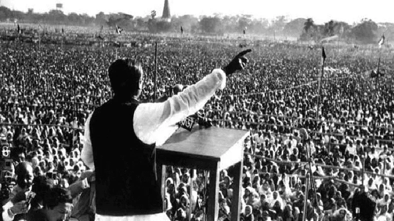 একজন বক্তা জনসমাগমে ভাষণ দিচ্ছেন, হাজার হাজার মানুষ উপস্থিত. Channel i News - চ্যানেল আই নিউজ