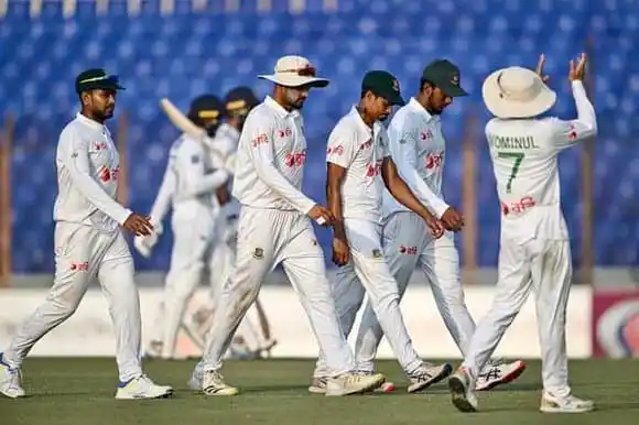 Bangladesh cricket team walking on the field during a match. Channel i News - চ্যানেল আই নিউজ
