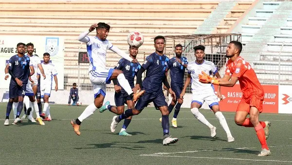 বাংলাদেশের ফুটবল ম্যাচে খেলোয়াড়রা গোলের জন্য লড়াই করছে. Channel i News - চ্যানেল আই নিউজ