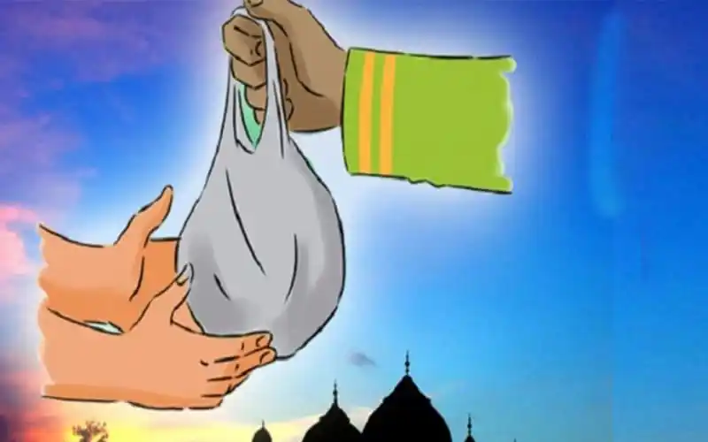 একজন ব্যক্তি ফিতরা দেওয়ার জন্য টাকা বা খাদ্য সামগ্রী দিচ্ছেন. Channel i News - চ্যানেল আই নিউজ