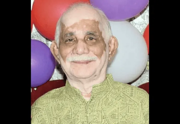 বৃদ্ধ ব্যক্তির হাসিমুখের ছবি, ব্যাকগ্রাউন্ডে রঙিন বলের সাজসজ্জা. Channel i News - চ্যানেল আই নিউজ