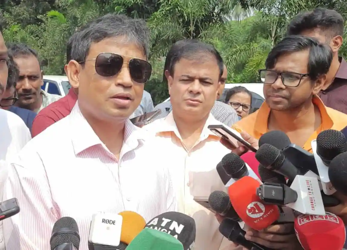 Bangladeshi politician speaking to media with microphones and reporters. Channel i News - চ্যানেল আই নিউজ