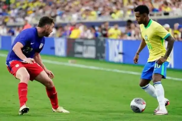Brazilian and Senegalese football players in action during a match. Channel i News - চ্যানেল আই নিউজ