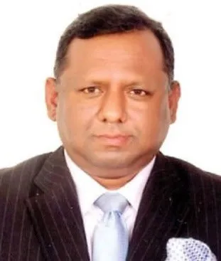 বাংলাদেশি ব্যক্তি পেশাদার পোশাকে, অফিসে বসে ছবি. Channel i News - চ্যানেল আই নিউজ