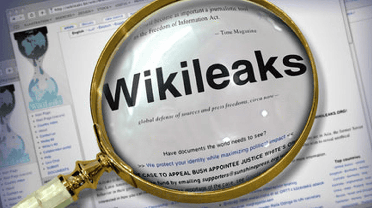 Wikileaks logo under magnifying glass on computer screen. Channel i News - চ্যানেল আই নিউজ