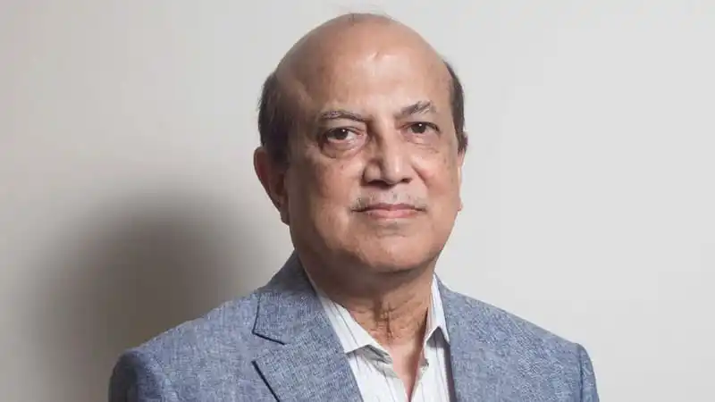 বয়স্ক ব্যক্তি একটি অফিসে বসে আছেন, শান্ত ও পেশাদার পরিবেশে।. Channel i News - চ্যানেল আই নিউজ