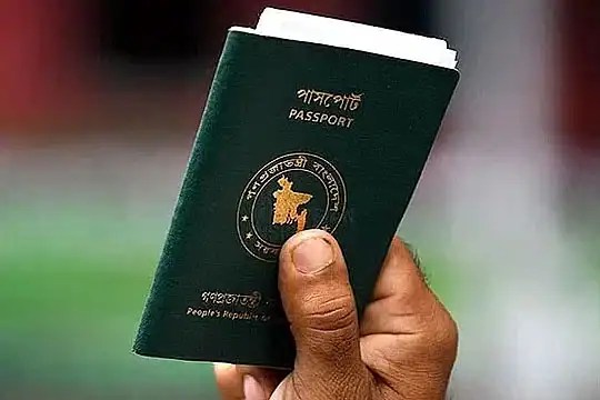 বাংলাদেশি পাসপোর্ট হাতে ধরা একটি ছবি. Channel i News - চ্যানেল আই নিউজ