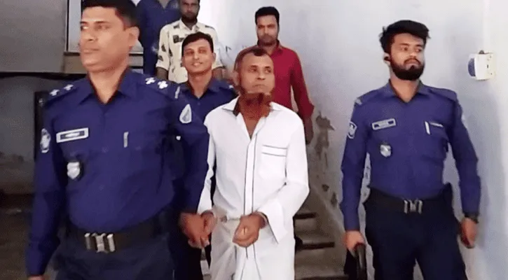 Police officers escorting a man in a white shirt in Bangladesh. Channel i News - চ্যানেল আই নিউজ