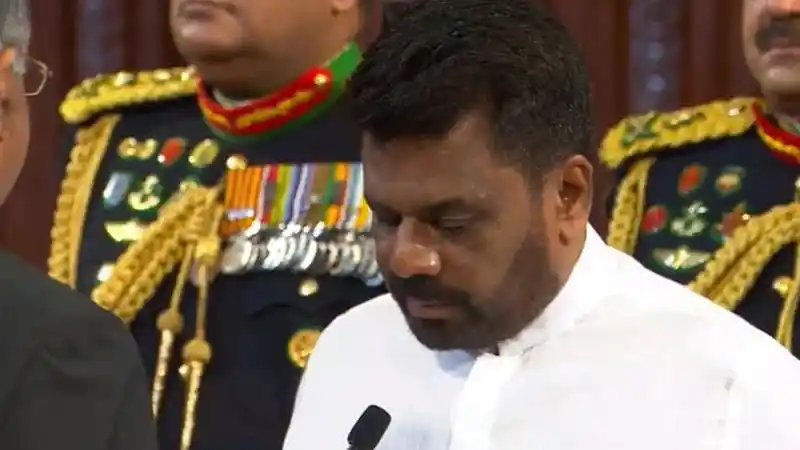 শ্রীলঙ্কার প্রেসিডেন্ট শপথ নিচ্ছেন, surrounded by military officers. Channel i News - চ্যানেল আই নিউজ