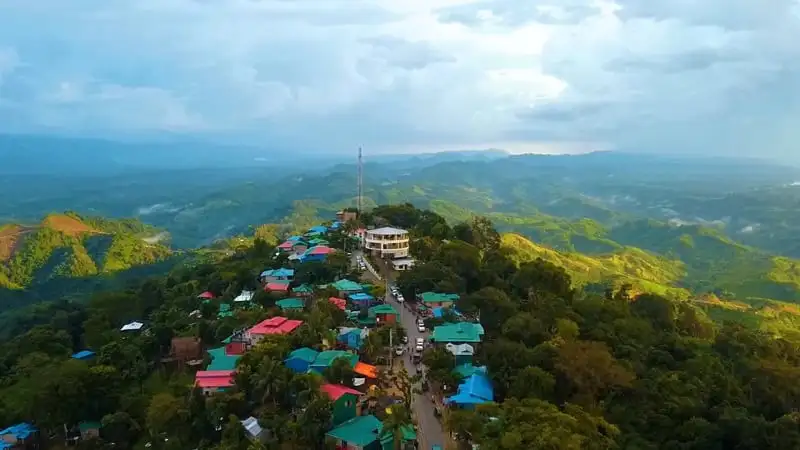 সাজেকের পাহাড়ি এলাকা ও ছোট ছোট বাড়িগুলির দৃশ্য. Channel i News - চ্যানেল আই নিউজ