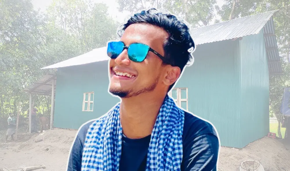 স্মার্ট যুবক সানগ্লাস পরে হাসছে, প্রকৃতি পেছনে. Channel i News - চ্যানেল আই নিউজ