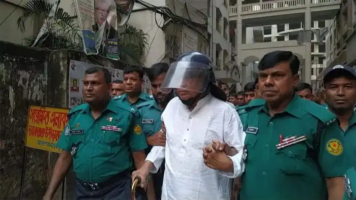 কারাগারে ইঞ্জিনিয়ার মোশাররফ হোসেন escorted by security personnel. Channel i News - চ্যানেল আই নিউজ