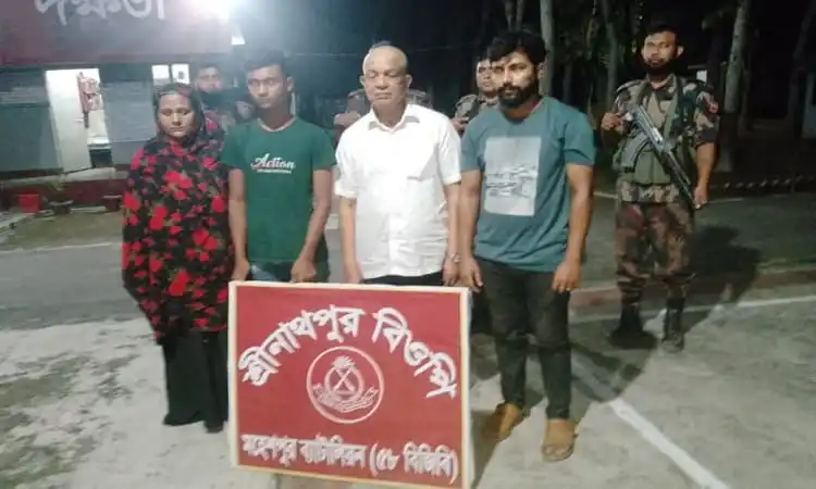 আটক সাবেক মন্ত্রী নারায়ণ চন্দ্রের ছবি, তার সঙ্গে অন্য ব্যক্তিরা উপস্থিত. Channel i News - চ্যানেল আই নিউজ