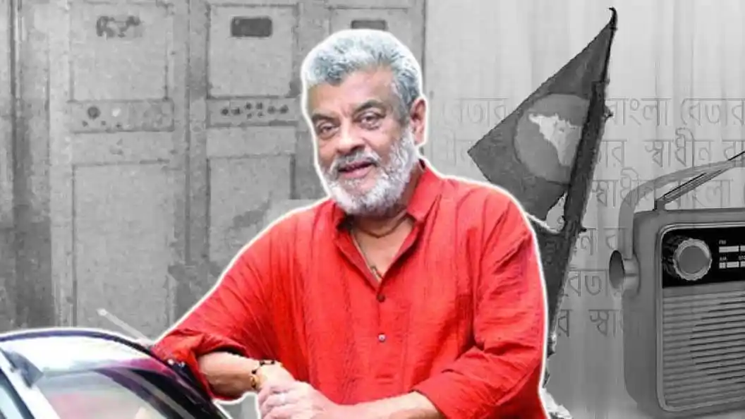 জনাব মোস্তফা বক্তৃতা দিচ্ছেন, পটভূমিতে বাংলাদেশি পতাকা. Channel i News - চ্যানেল আই নিউজ