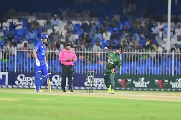 Cricket players and umpire on the field during a match at Channel i Online. Channel i News - চ্যানেল আই নিউজ