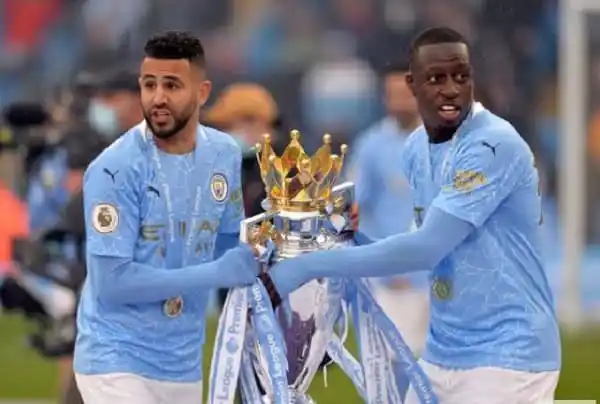 Manchester City players holding a trophy after winning a match. Channel i News - চ্যানেল আই নিউজ