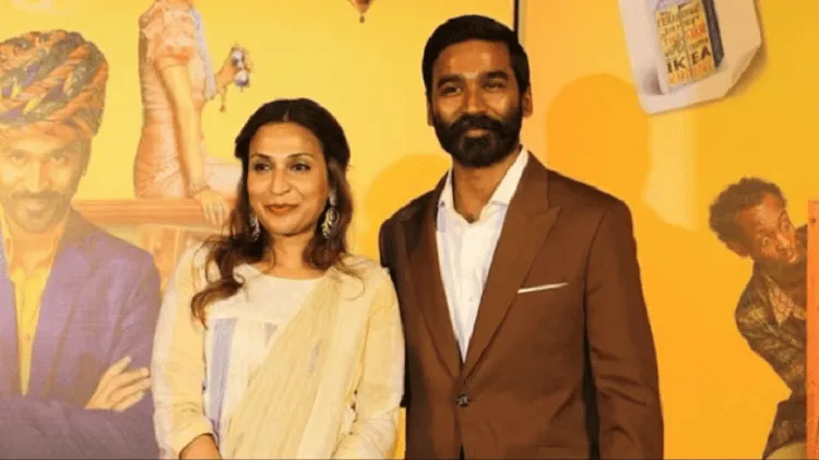 দম্পতি হাস্যোজ্জ্বলভাবে ছবি তুলছেন, পটভূমিতে রঙিন ব্যাকড্রপ।. Channel i News - চ্যানেল আই নিউজ