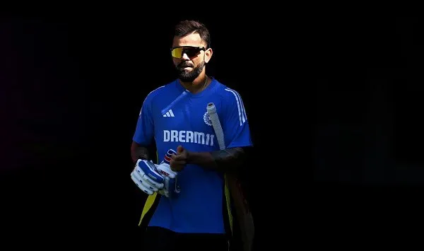 বাংলাদেশ ক্রিকেটার ড্রেসে, sunglasses পরা, ক্রিকেট ব্যাট হাতে. Channel i News - চ্যানেল আই নিউজ