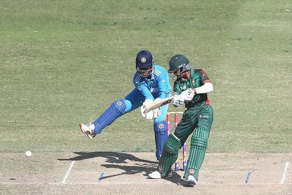 বাংলাদেশি ব্যাটসম্যানের শট, ভারতীয় ফিল্ডার ডাইভিং করে বল আটকানোর চেষ্টা করছে. Channel i News - চ্যানেল আই নিউজ