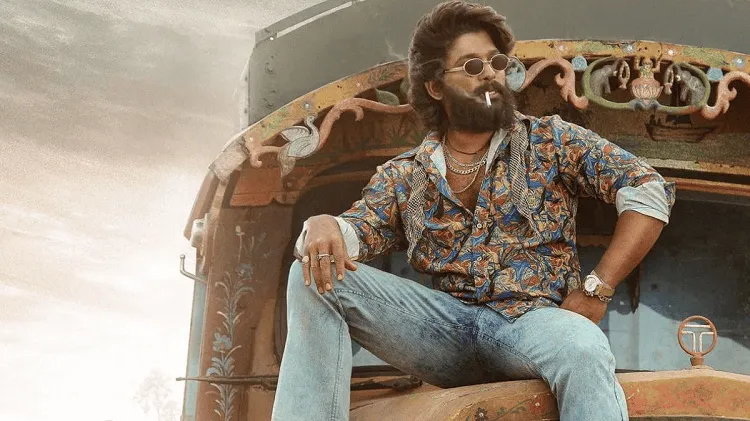 অভিনেতা পুষ্পা টু সিনেমার চরিত্রে, ক্যাজুয়াল পোশাক ও সানগ্লাসে বসে আছেন. Channel i News - চ্যানেল আই নিউজ